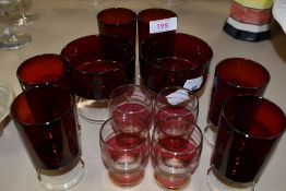 A collection of vintage red drinking glasses.