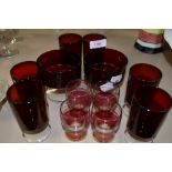 A collection of vintage red drinking glasses.