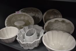 Seven vintage ceramic jelly moulds.