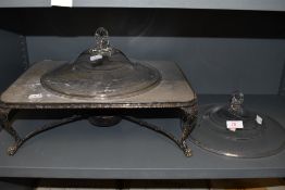 A vintage warming plate having gas burner to underside, also included are two glass tureens lids.