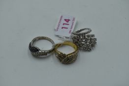 Three lady's silver and gold plate on silver dress rings having cubic zirconia decoration