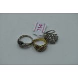 Three lady's silver and gold plate on silver dress rings having cubic zirconia decoration