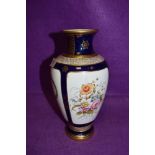 A hand decorated vase by Coalport Townsend having cobalt and gold having heir line crack to neck AF