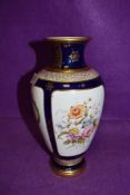 A hand decorated vase by Coalport Townsend having cobalt and gold having heir line crack to neck AF