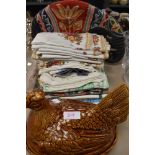 A retro chicken egg dish with lid an elephant tea cosy and a variety of tea towels.