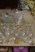 An assortment vintage and modern drinking glasses.