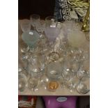 An assortment vintage and modern drinking glasses.