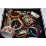 A large selection of costume jewellery bangles including, wood, plastic, metal etc