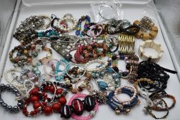 A large selection of costume jewellery bracelets of various forms