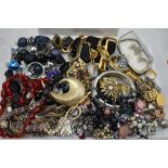 A tray of costume jewellery including cufflinks, beads, brooches etc