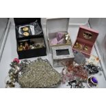 A selection of costume jewellery including earrings, pins, evening bag etc