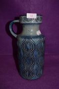 A mid century vase by West German pottery in a blue glaze