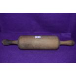 An farm house kitchen style rolling pin of large proportions in beech wood 50cm long