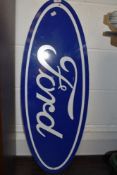 A garage or workshop advertising board/ sign for Ford.