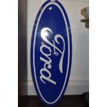 A garage or workshop advertising board/ sign for Ford.