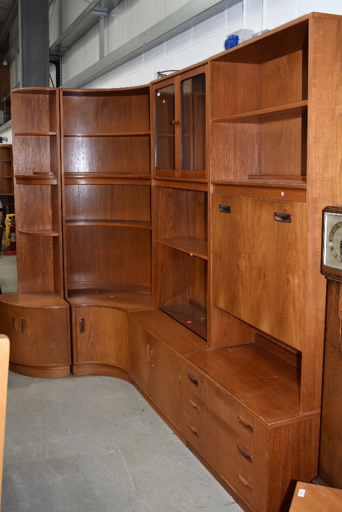 Four sections of vintage teak G plan wall units, including corner pieces, glazed display and desk or