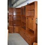 Four sections of vintage teak G plan wall units, including corner pieces, glazed display and desk or