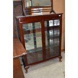 A reproduction mahogany display cabinet having internal glass shelves