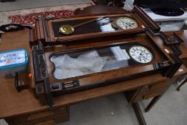 A 19th Century Vienna style wall clock having enamelled dials , pendulum and weights present