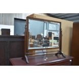 An early 20th Century mahogany toilet mirror in classical design with part turned frame, width