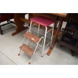 a set of vintage metal and wooden fold away steps