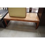 A vintage mid century teak coffee table