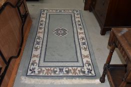 A modern oriental style fireside rug, approx. 184 x 90cm