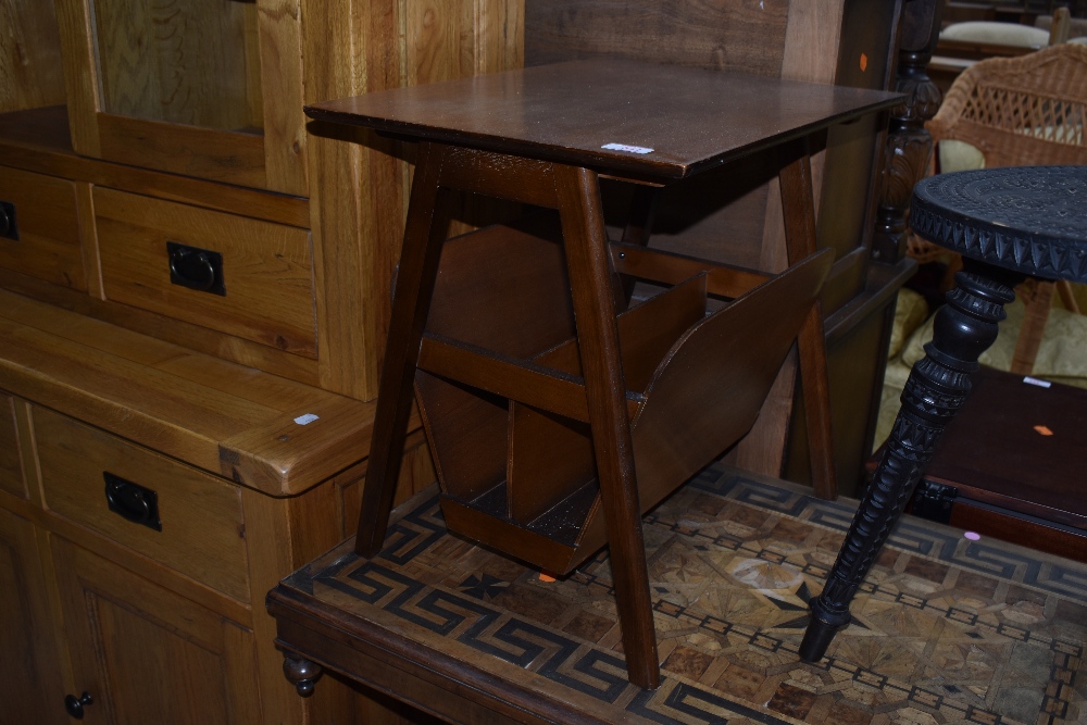 A vintage stained ply magazine table