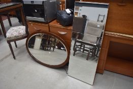 An over mantle oval mirror having bevel edged glass