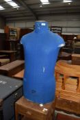 A vintage tailors or dress makers dummy having blue cover by Cleo
