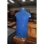 A vintage tailors or dress makers dummy having blue cover by Cleo