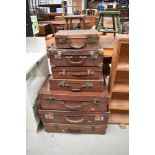 A large selection of vintage cases, including leather