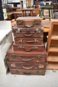 A large selection of vintage cases, including leather