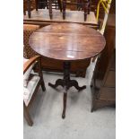 A 19th Century mahogany occasional pedestal table on triple splay legs, top marked and split,