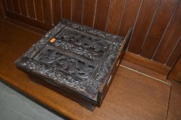 a reproduction bible box and stand with carved detailing