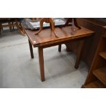 An early 20th Century oak drawer leaf table