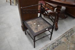 A parlour musicians or similar grotto style corner chair having turned spindle frame