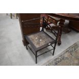 A parlour musicians or similar grotto style corner chair having turned spindle frame