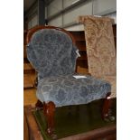 A Victorian ballon back nursing chair on knurl legs , having later upholstery