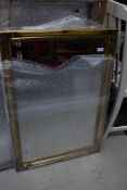 A reproduction gilt framed mirror, approx. 87 x 60cm