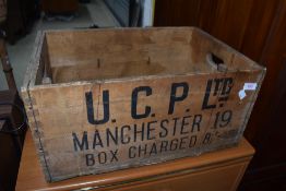 A vintage wooden advertising crate for Manchester some worm present
