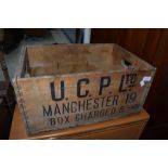 A vintage wooden advertising crate for Manchester some worm present