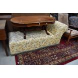 A traditional chaise longue having vintage yellow paisley cotton cover