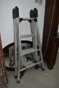 A set of fold out aluminium step ladders