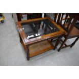 A modern stained frame glass top coffee table, approx. 69 x 54cm