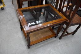 A modern stained frame glass top coffee table, approx. 69 x 54cm