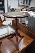 A reproduction wine table having leather top 50cm high