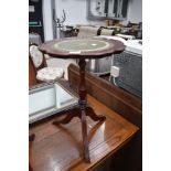 A reproduction wine table having leather top 50cm high