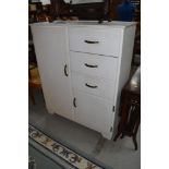 A small wardrobe having drawer set and cloak cupboard 92cm wide by 112cm high