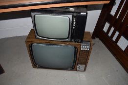 Two vintage television sets and bakelite radio case